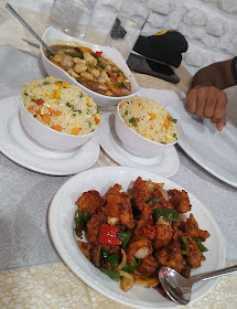 Colourful chicken dishes and fried rice served at Mega Chicken